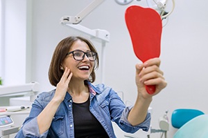 Woman smiling with dental implants in Worcester