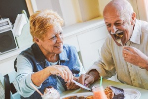 happy older couple eating 