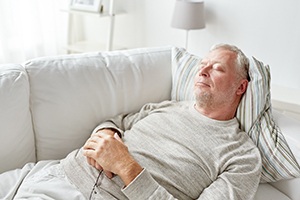 Man resting with dental implants in Worcester