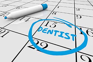 Calendar reminding you to visit your Worcester implant dentist for checkups