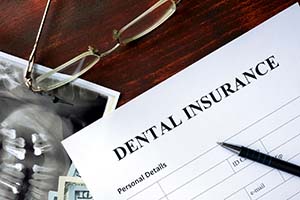 Dental insurance paperwork for the cost of dental implants in Worcester