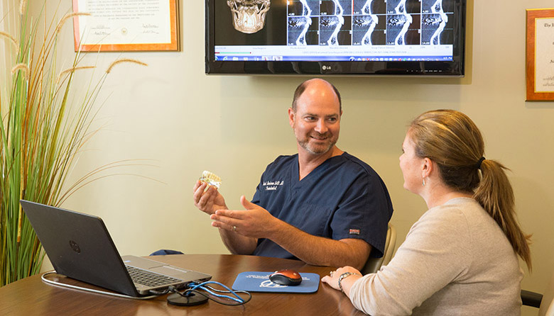 Worcester implant dentist discussing with patient