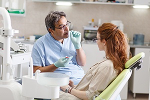 Dentist talking to patient