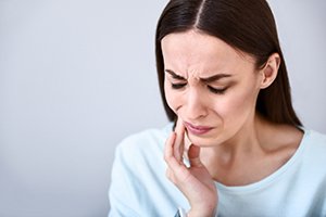 Woman with tooth pain in Worcester