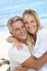 Smiling couple at the ocean