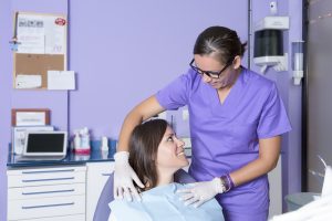 dental assistant and patient