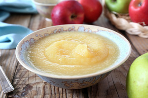 Large bowl of applesauce on wooden table